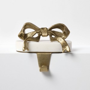 Marble and Metal Bow Stocking Holder Gold - Threshold™ designed with Studio McGee - 1 of 3