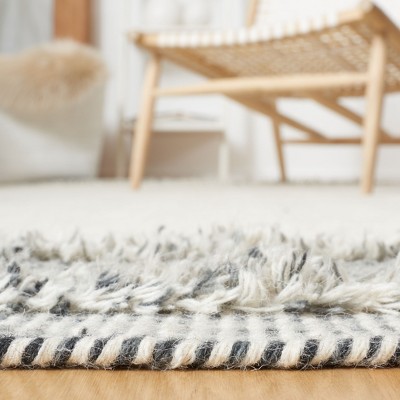Ivory Hand-Tufted Wool and Synthetic 9' x 12' Rectangular Rug
