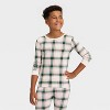 Kids' Plaid Ribbed Long Sleeve Shirt and Pants Holiday Matching Family Pajama Set - Wondershop™ Cream - 3 of 4
