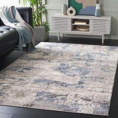 Ivory and Blue Abstract 8' x 10' Synthetic Area Rug
