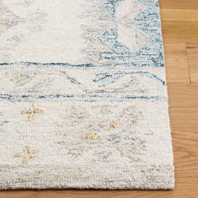 Handmade Blue and Ivory Wool 4' x 6' Tufted Area Rug