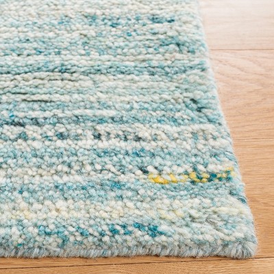 Ivory and Turquoise Handwoven Wool Shag Area Rug, 5' x 8'