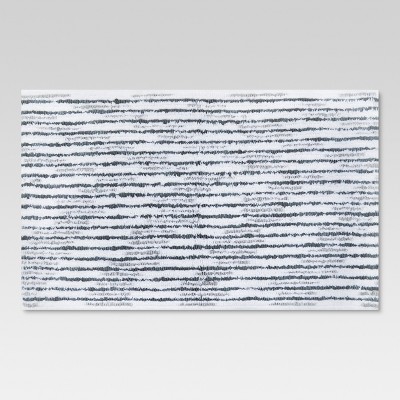 gray and white bath mat