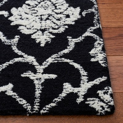 Black and Ivory 6' x 9' Hand-Tufted Wool Area Rug