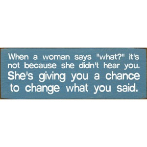 Slickblue When a Woman Says What Sign, 3.5x10 Funny Relationship Quote Plaque, Rustic Knotty Pine Wall or Shelf Decor - 1 of 3