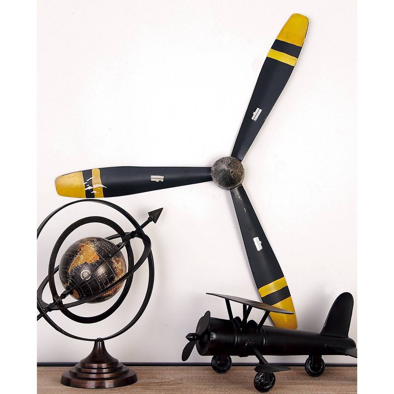 31&#34; x 27&#34; Metal Airplane Propeller 3 Blade Wall Decor with Aviation Detailing Black - Olivia &#38; May, 1 of 8