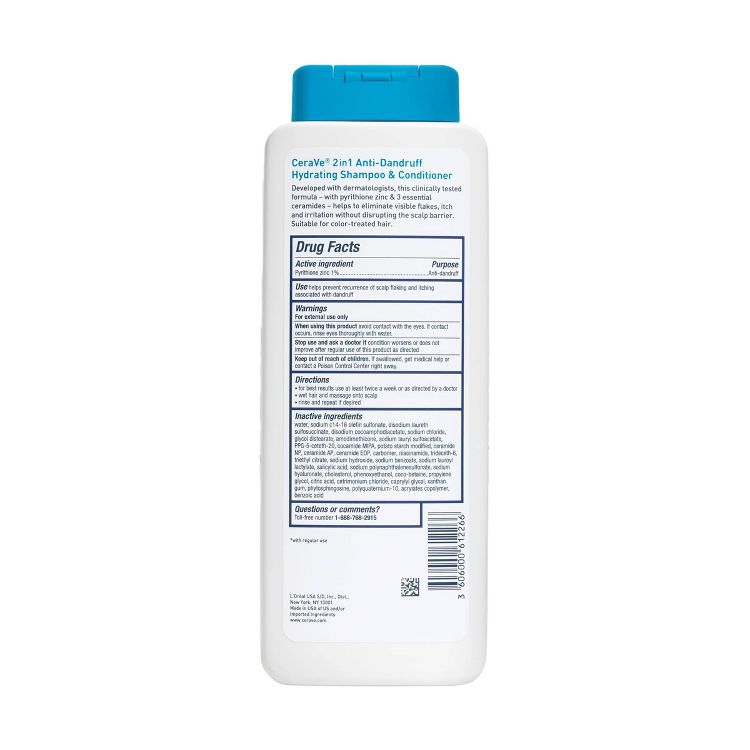 White bottle of CeraVe 2-in-1 Anti-Dandruff Hydrating Shampoo & Conditioner with a blue cap, showing detailed drug facts and ingredients on the back label.