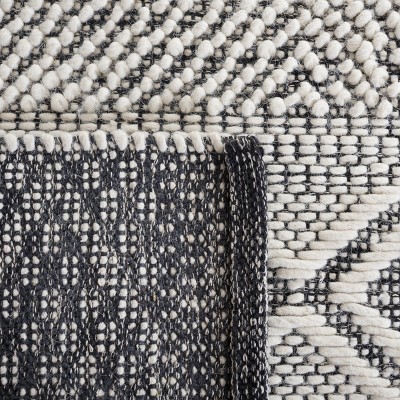 Handmade Black and Ivory Wool Area Rug 3' x 5'