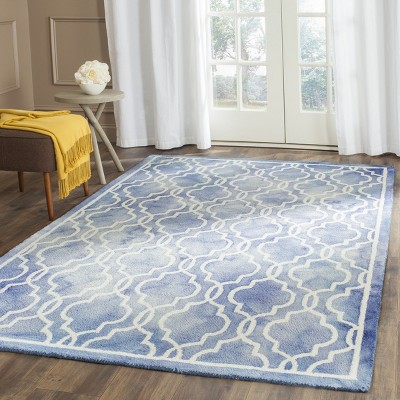 Blue and Ivory Tufted Wool 4' x 6' Area Rug
