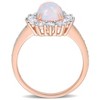 EVERLY JEWELRY | Rose Silver 2 1/6 ct TGW Oval Shape Blue Ethiopian Opal and White Topaz and 1/10ct TDW Diamond Halo Ring - 4 of 4
