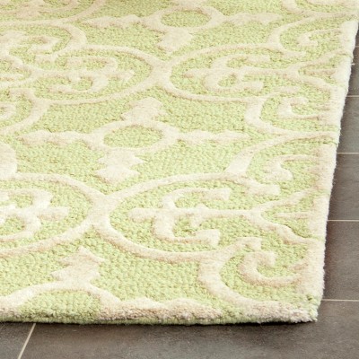 Handmade Light Green and Ivory Wool Tufted Area Rug 5' x 8'