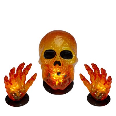 Northlight 8.5" Lighted Orange Skull and Hands Outdoor Halloween Decoration - 4ft Black Wire