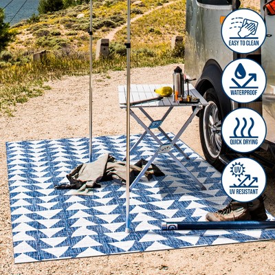 Ivory and Blue Geometric 4' x 6' Synthetic Area Rug