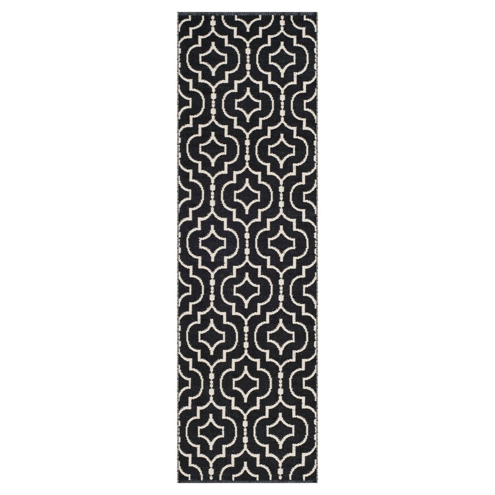 2'3inx7' Runner Black/Ivory Quatrefoil Design Woven - Safavieh