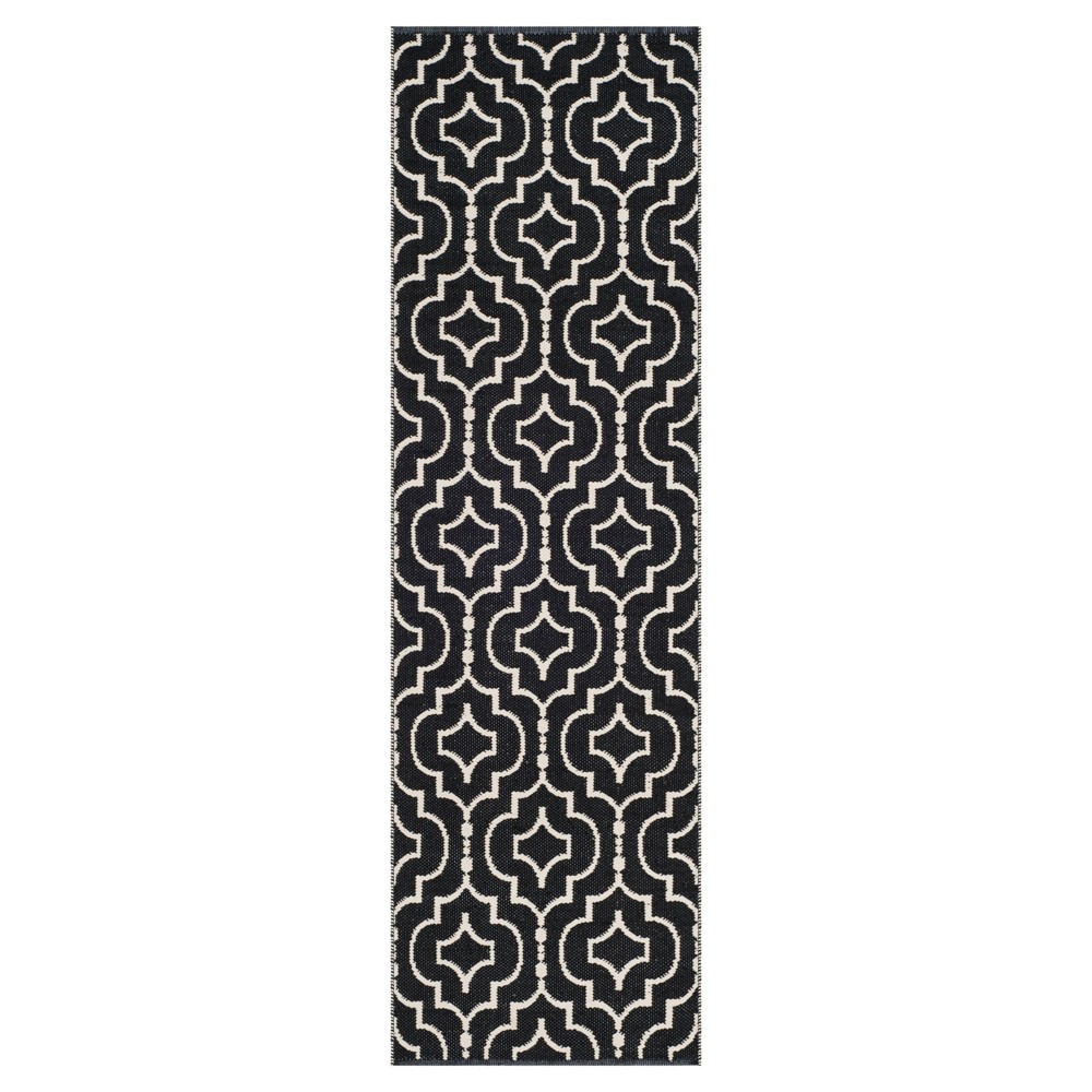 2'3inx7' Runner Black/Ivory Quatrefoil Design Woven - Safavieh