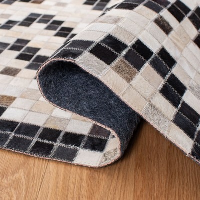 Handmade Black and Ivory Geometric Cowhide Area Rug