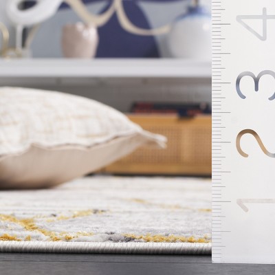 Ivory and Gold Modern Abstract 4' x 6' Synthetic Rug