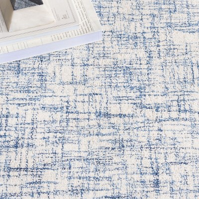 Ivory Tufted Handmade Wool Rectangular 6' x 9' Area Rug