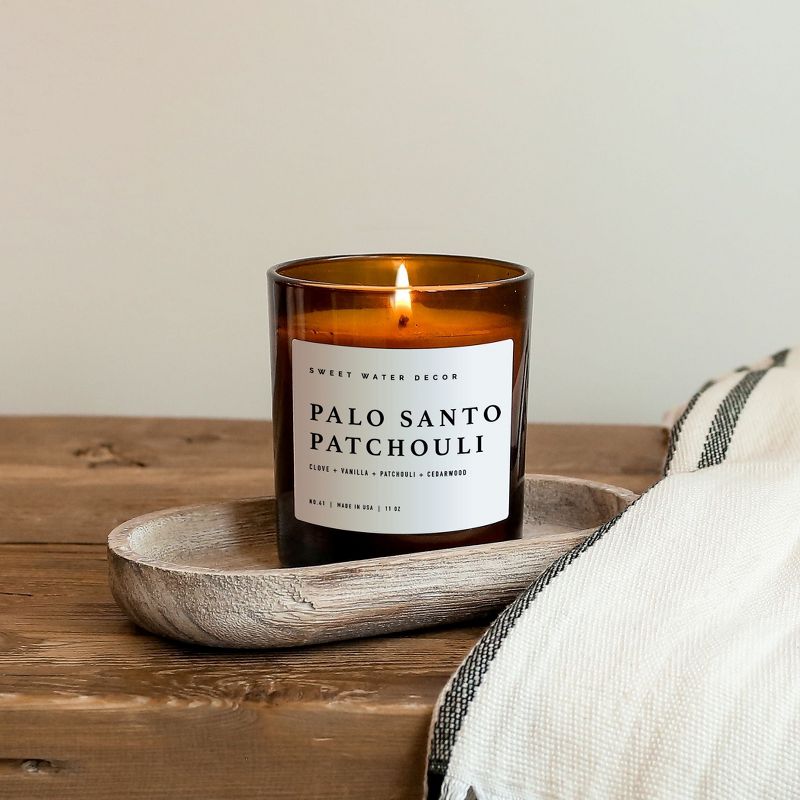 Sweet Water Decor Palo Santo Patchouli 11oz Amber Jar Soy Candle, 2 of 6