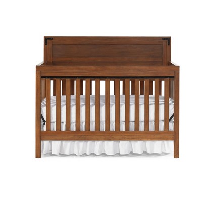 brown convertible crib