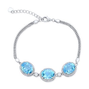 Simona Sterling Silver, White Topaz Border, Oval Gemstone Bracelet - Blue Topaz (13.34cttw) - Blue - 7+1 Inch - 1 of 2