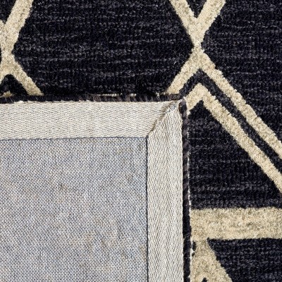 Handmade Black and Ivory Wool Abstract Area Rug