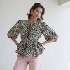 Knit & Lounge Women’s Animal Print Puff Sleeve Peplum Blouse Tie Front Split Neckline Adjustable Waist Feminine Statement Top - 3 of 4