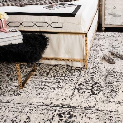 Ivory and Black Floral Motif Synthetic Area Rug