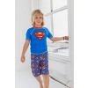 DC Comics Justice League Batman Toddler Boys Rash Guard and Swim Trunks Outfit Set - 2 of 4