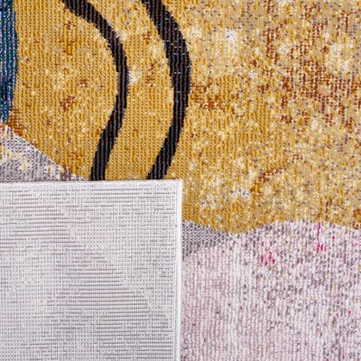 Ivory and Multicolor Abstract 8' x 10' Synthetic Area Rug