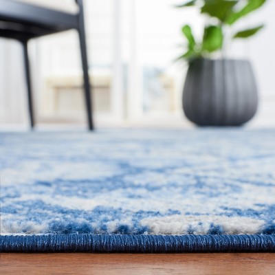 Handmade Round Blue and Ivory Synthetic Area Rug, 4'x6'