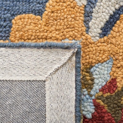 Handmade Blue Wool Floral 6' x 9' Area Rug