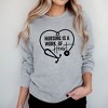 Simply Sage Market Women's Graphic Sweatshirt Nursing Is A Work Of Heart - 2 of 3