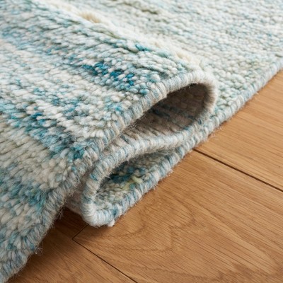 Ivory and Turquoise Handwoven Wool Shag Area Rug, 5' x 8'