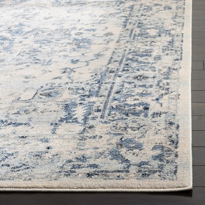 Ivory and Navy 8' x 10' Synthetic Oriental Area Rug