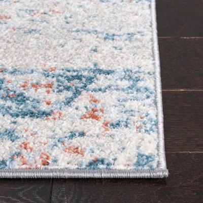 Ivory and Blue Abstract 9' x 12' Stain-Resistant Rug