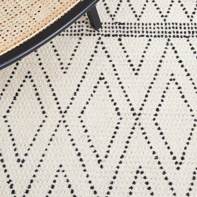 Casablanca Hand-Tufted Black and Ivory Shag Wool Rug - 3' x 5'
