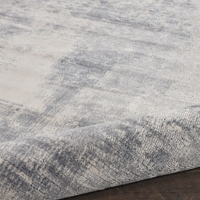 Round Blue and Ivory Abstract Area Rug 7'10"