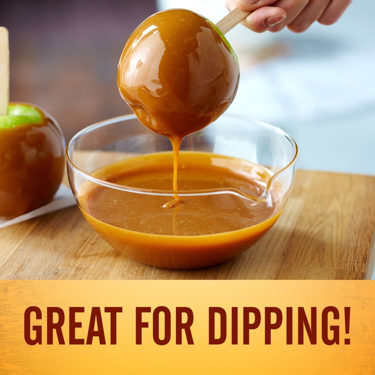 A caramel apple being dipped into a bowl of caramel with the text "GREAT FOR DIPPING!" below.