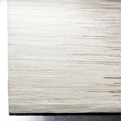 Handmade Ivory and Charcoal Geometric Cowhide Area Rug