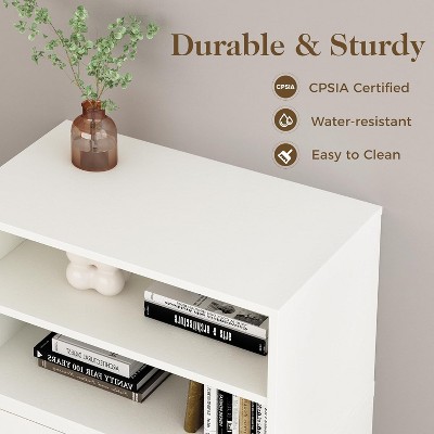 White storage dresser/console with multiple shelves and a plant on top