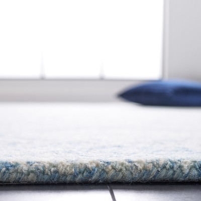 Handmade Blue and Ivory Wool Abstract Tufted Area Rug 5' x 8'