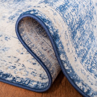 Ivory and Navy Classic Synthetic Round Rug, 6' x 9', Stain-Resistant