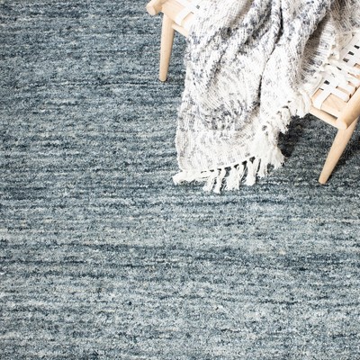 Handmade Himalaya Tufted Blue Wool Rectangular Rug - 5' x 8'