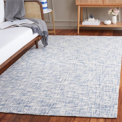 Ivory Tufted Handmade Wool Rectangular 6' x 9' Area Rug