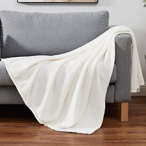 Cannon 60"x80" Solid Plush Ivory Throw Blanket - 1 of 4