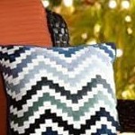 brown wicker+orange cushion