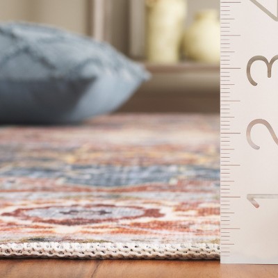 Rust and Blue Green 4' x 6' Synthetic Washable Area Rug