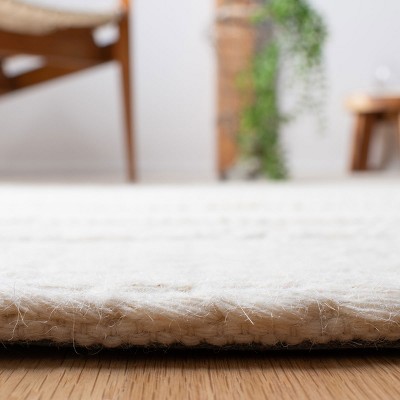 Ivory Hand-Tufted Wool Area Rug 6' x 9'