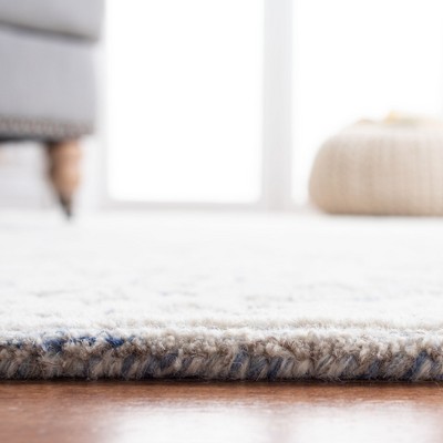 Blue and Ivory Hand-Tufted Wool 4' x 6' Area Rug